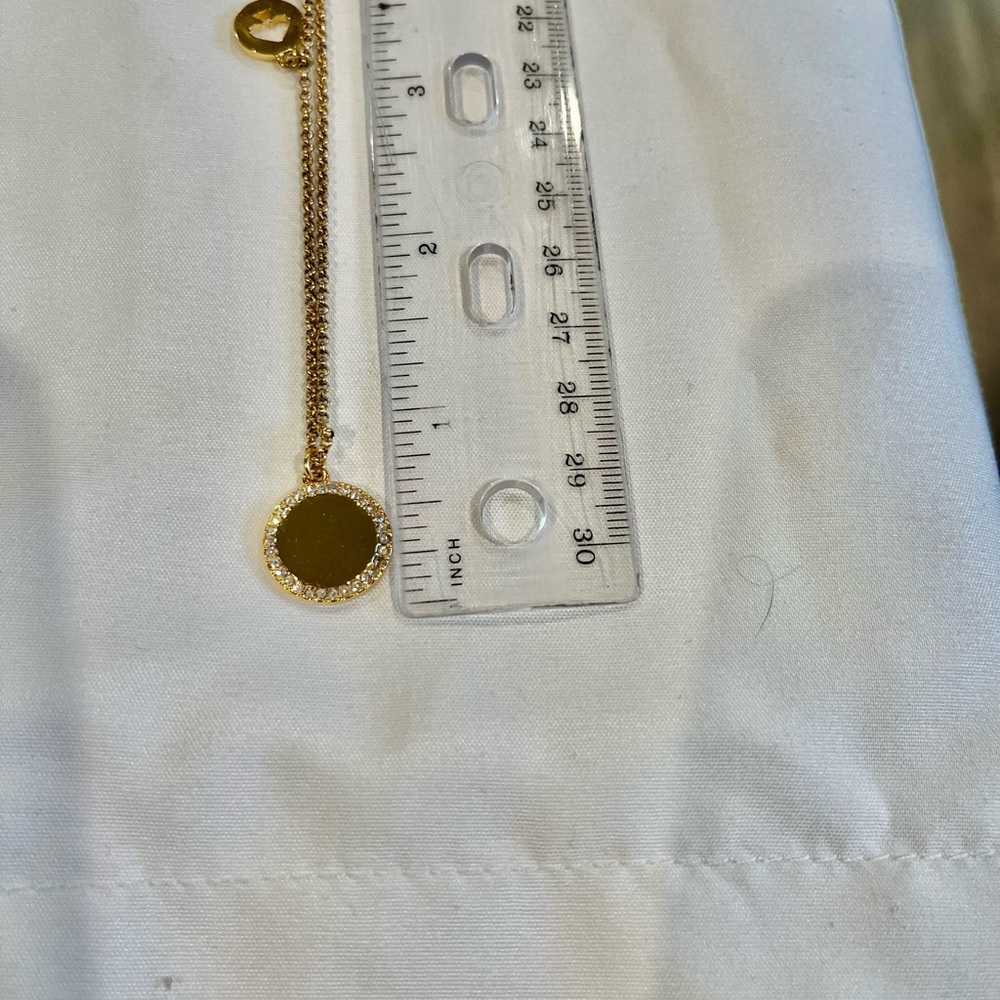Kate Spade Rose colored gold necklace